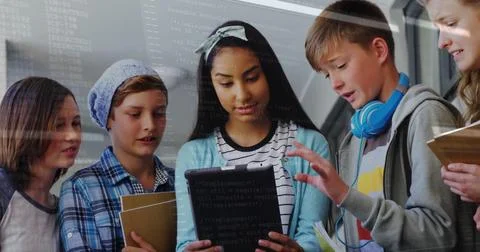Gathering five students collaborating on tablet in school corridor, with Stock Photos