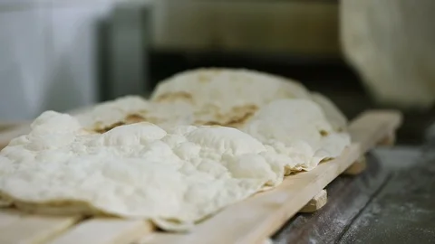 Gathering hot fresh bread Stock Footage 122065600