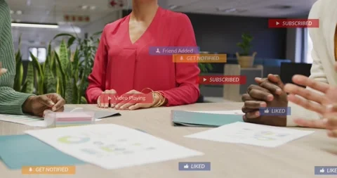 Gathering team around table in office, red-blouse leader placing hands over Stock Footage 332285190