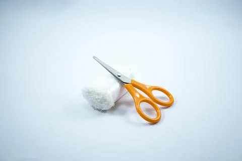 Gauze rolls and mini scissors are usually used for first aid bandages Stock Photos