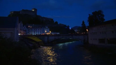 Gave de Pau river through Lourdes, France at night Stock Footage 86758449
