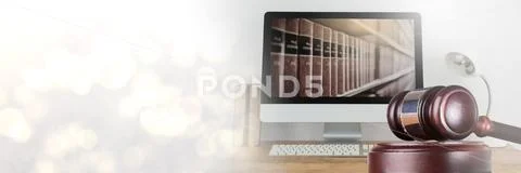 Gavel and computer with books of law and justice with transition Stock Photos