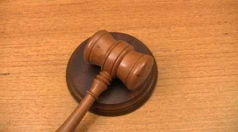 A gavel strikes a sound block. Stock Footage
