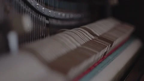 Gavel of the string open mechanism. Inside of a piano. 4k Video stock 137840095