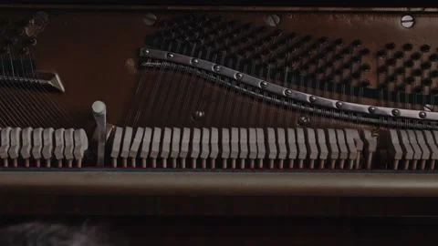 Gavel of the string open mechanism. Inside of a piano. 4k Stock Footage 137840117