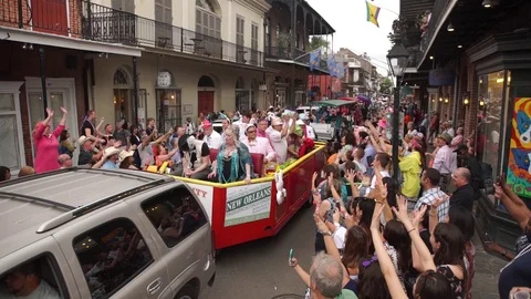 Gay Easter Holiday Parade Float in New Orleans with Throwing Mardi Gras Stock Footage 100092732