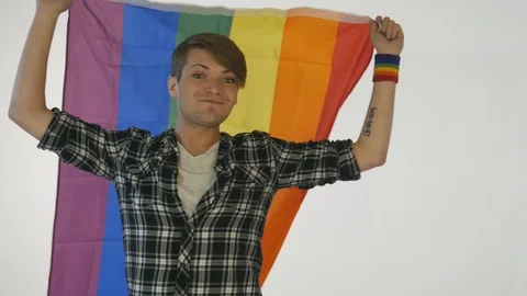 Gay guy holding rainbow flag Stock Footage 95114592