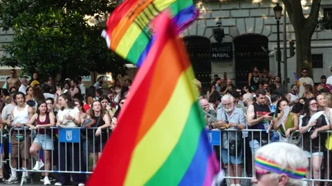 Gay man dances while waving a rainbow flag Видео 339205233