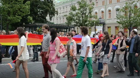 Gay parade poster flags expressing slogans police protect order Stock Footage 35751860