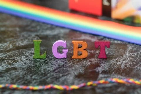 Gay pride letters LGBT, gray-black background Stock Photos