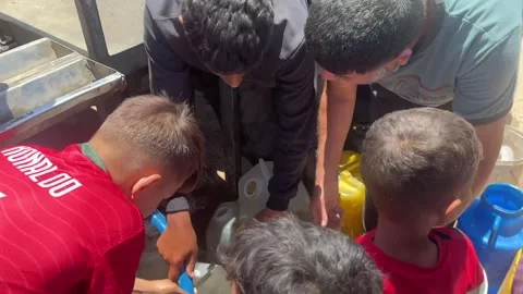 Gaza Residents Queue For Water 4 Stock Footage 336315815