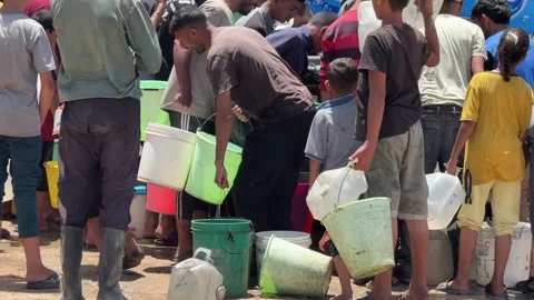 Gaza Residents Queue For Water 6 Stock Footage 336315808