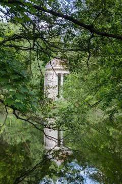 Gazebo with columns in the classical style in the park Stock Photos