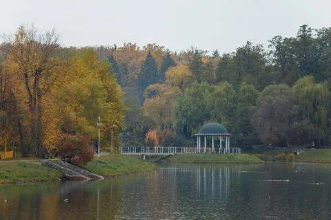 Gazebo in the park surrounded by fall foliage at autumn, Feofania Stock Photos