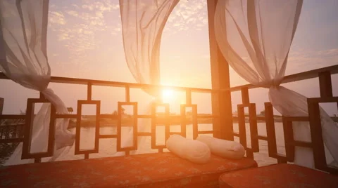 Gazebo with sea view, sunset falling over the beach Stock Footage 61304345