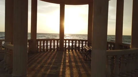 Gazebo on the seashore during sunset Stock Footage 238462081