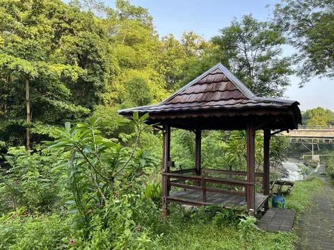 Gazebo surrounded by tree in the park Stock Photos