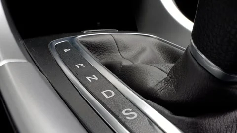 Gear shift console with drive mode indicators in modern vehicle Stock Footage 325037627