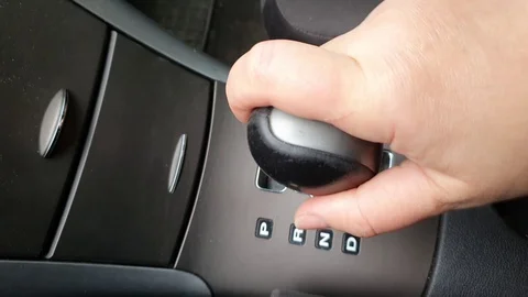 Gear shift knob in a car with automatic transmission. Black color. Stock Footage 124211158