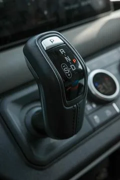 A gear shift with the letters P, N, and D on it. The shift is black and has.. Stock Photos