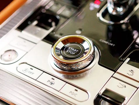 Gear shift lever for automatic transmission. Engine start button. close-up Stock Photos