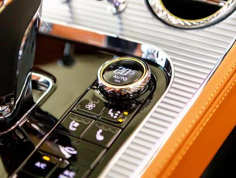 Gear shift lever for automatic transmission. Engine start button. close-up Stock Photos