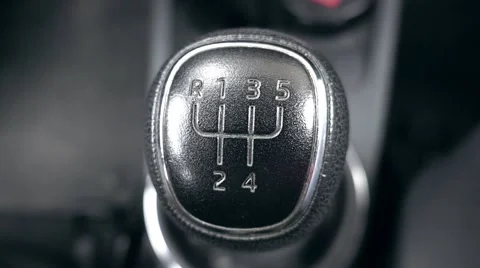 Gear stick inside modern car going out of focus Stock Footage 68068816