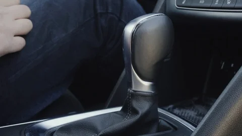 Gearbox in the car. The man switches the automatic transmission. Transmission Stock Footage 88914053