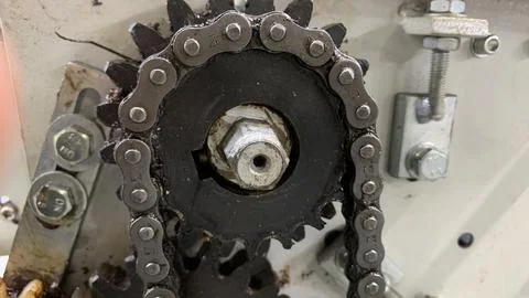 Gears and chains on the engine machine Stock Photos