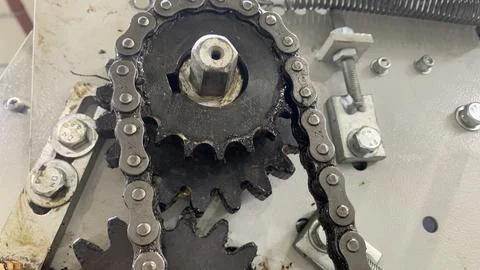 Gears and chains on the engine machine Stock Photos