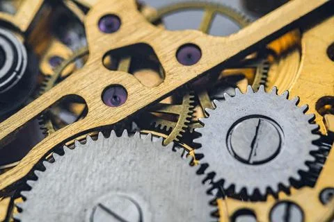 Gears and cogs inside clock. Close-up view on retro watches. 스톡 사진