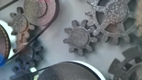 Gears and cogs mechanism turning, representing teamwork, industry, and progress Stock Footage 320520874