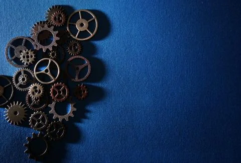 Gears on blue Stock Photos