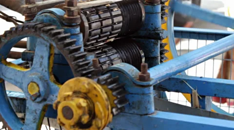 The gears of a blue sugarcane extractor turn. Stock Footage 37564253
