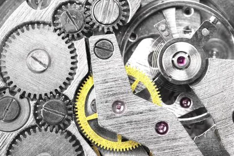 Gears of a mechanical watch close-up top view Stock Photos