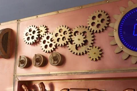 Gears on the old style copper panel Foto stock
