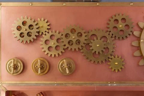 Gears on the old style copper panel Stock Photos