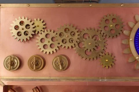 Gears on the old style copper panel Stock Photos