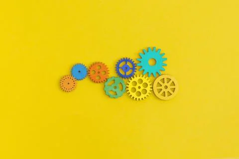 Gears on yellow background Stock Photos