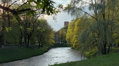 Gediminas Tower and river flowing in Bernardine Garden in spring in Vilnius Stock Footage 273148441