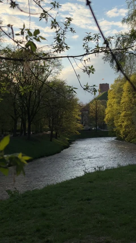 Gediminas Tower and river flowing in Bernardine Garden in spring in Vilnius Stock Footage 273148454