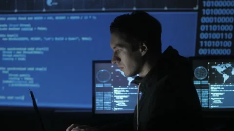 Geek Hacker programmer is working on computer in cyber security center filled Stock Footage 86893780
