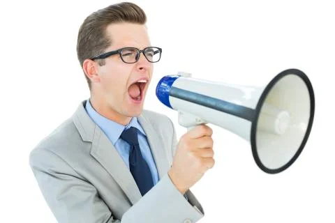 Geeky businessman shouting through megaphone Stock Photos