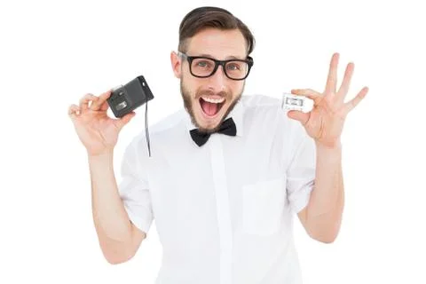 Geeky hipster holding a retro tape cassette player Stock Photos