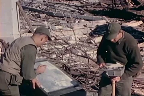Geiger-Mueller counter team reading the amount of radiation - 1945 Stock Footage 106078944