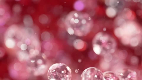 Gel balls explosion and flying away on the red background. Stock Footage 309034361