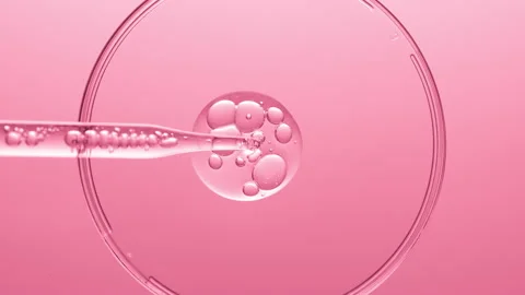 Gel with bubbles comes out from lab dropper into petri dish Stock Footage 167316334