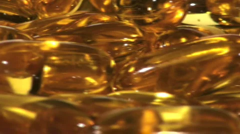 Gel capsules loop close-up - HD  Stock Footage 352456