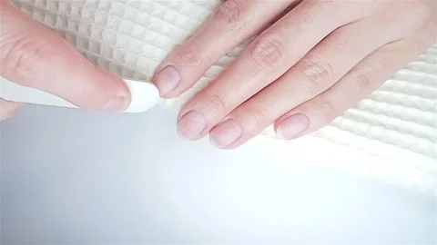 Gel polish manicure step-by-step video tutorial. Step 3 Nails buffing Video stock 277359812