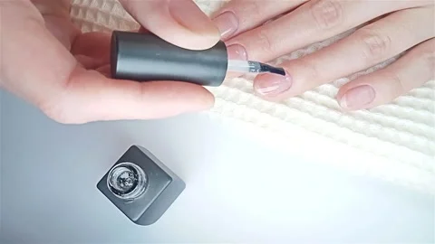 Gel polish manicure step-by-step video tutorial. Step 7 Nails base coat Video stock 277360833